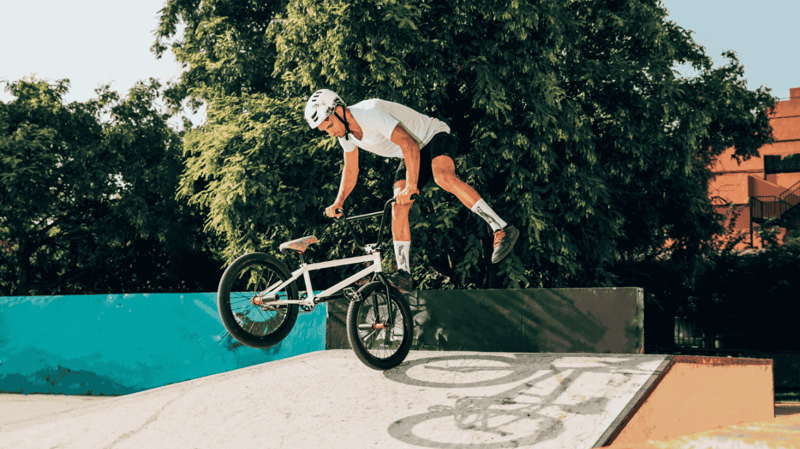 A young man doing Freestyle Bmx Tricks