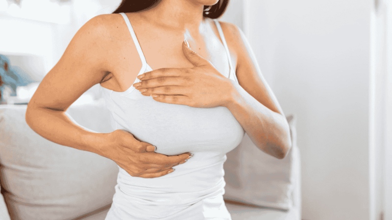 A lady doing self-breast examination