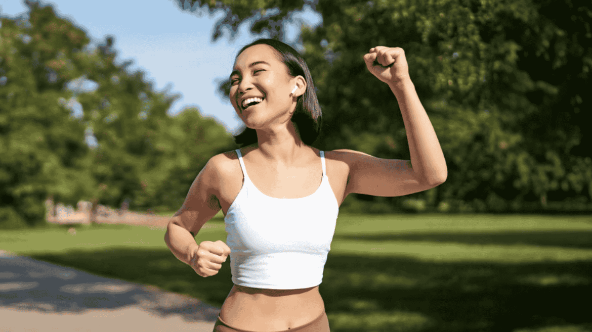 Woman running with big smile 