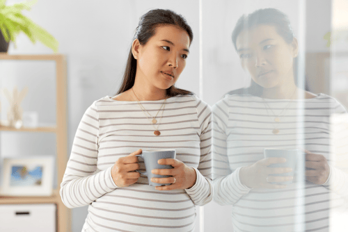 sad woman drinking coffee