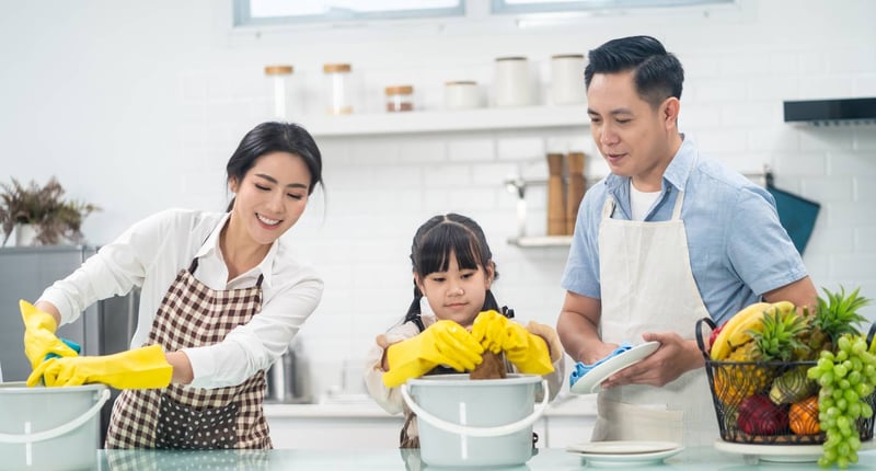 Young family cleaning at kitchen to against COVID-19