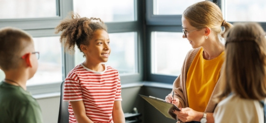 School psychologist with a group of school children