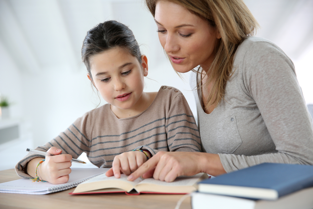Mother Helping Daughter with Homework