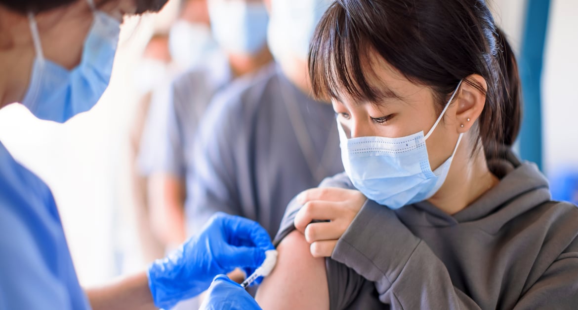 women receiving vaccine