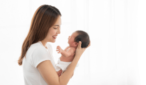 New mum holding newborn baby