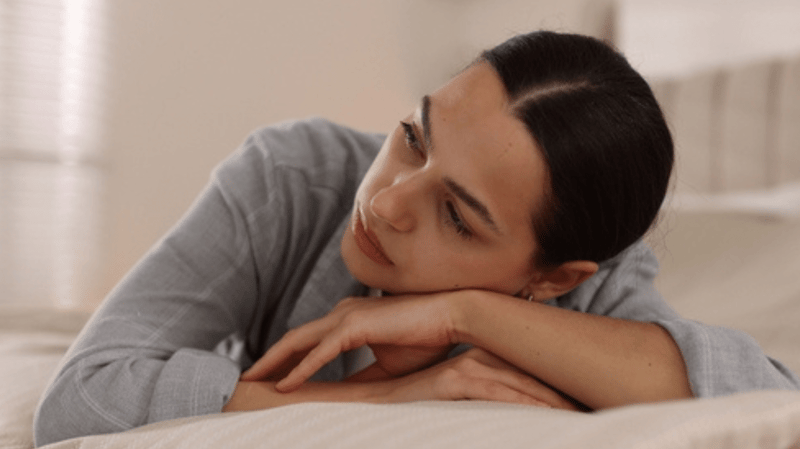 A sad woman thinking about her problems