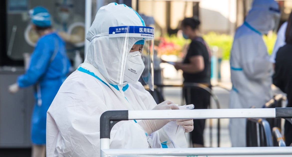 Healthcare worker preparing Covid test kits in China