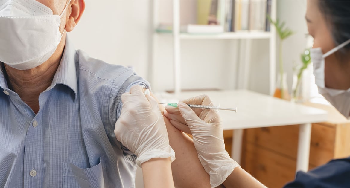 Elderly receiving a COVID-19 vaccine