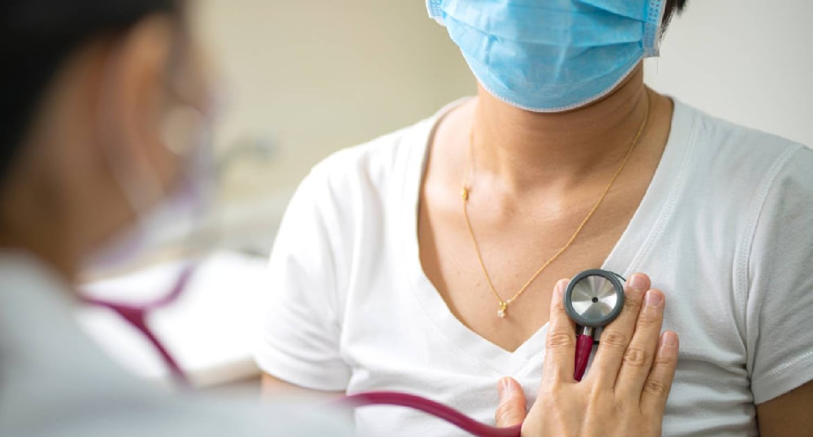 Dr checking heart rate for a lady