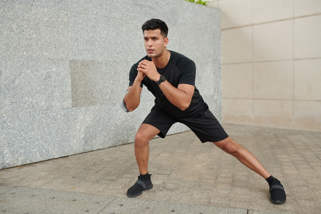 a man doing side lunge