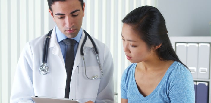 Doctor and nurse talking about Gastrointestinal Cancer 