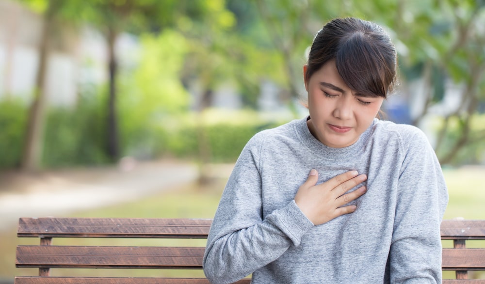 woman suffering from acid reflux 