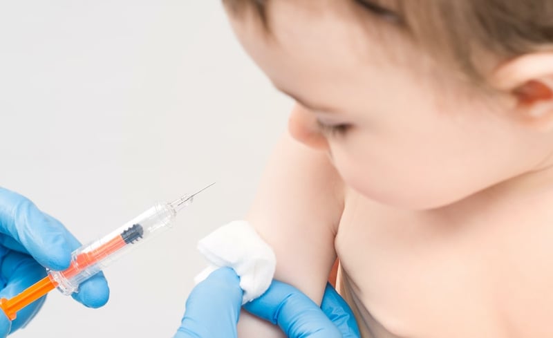 child receiving vaccination