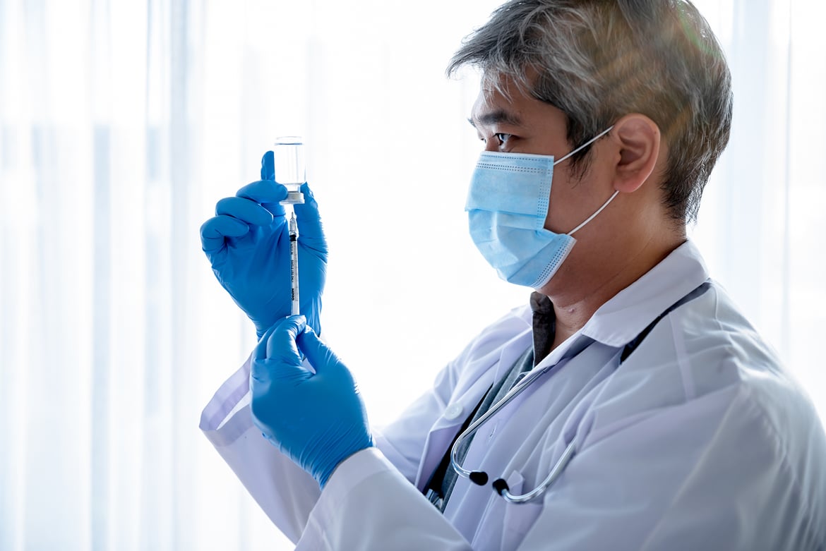 A doctor with syringe in-hand