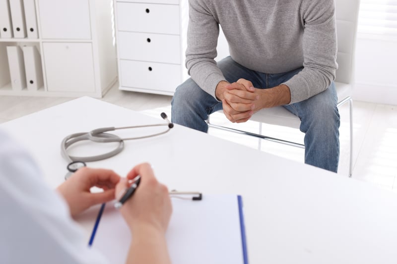 Man having appointment with STD specialist in clinic, closeup
