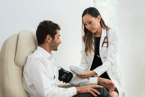 doctor taking blood pressure