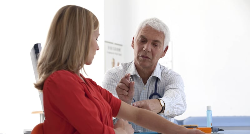 A doctor talking to a woman