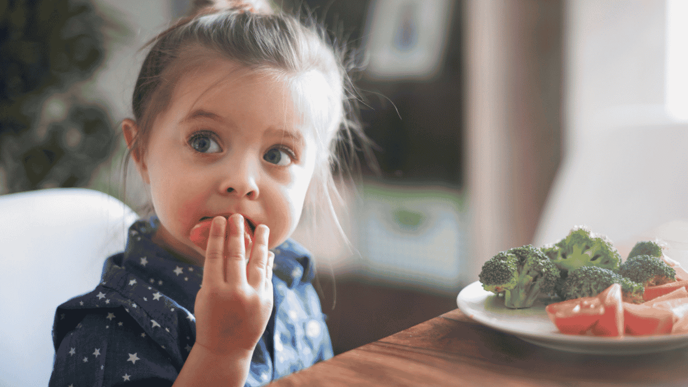 a-little-girl-eating-vegetables