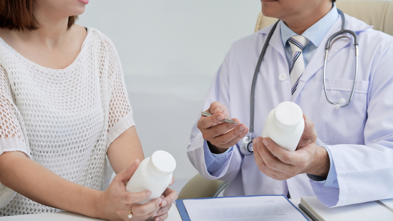  Doctor consulting with patient about pills