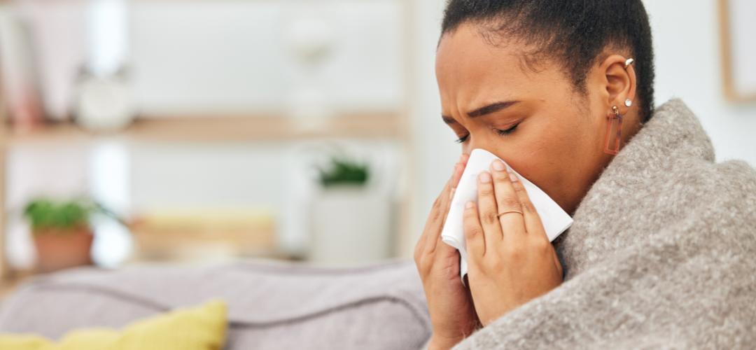 Black woman sneezing