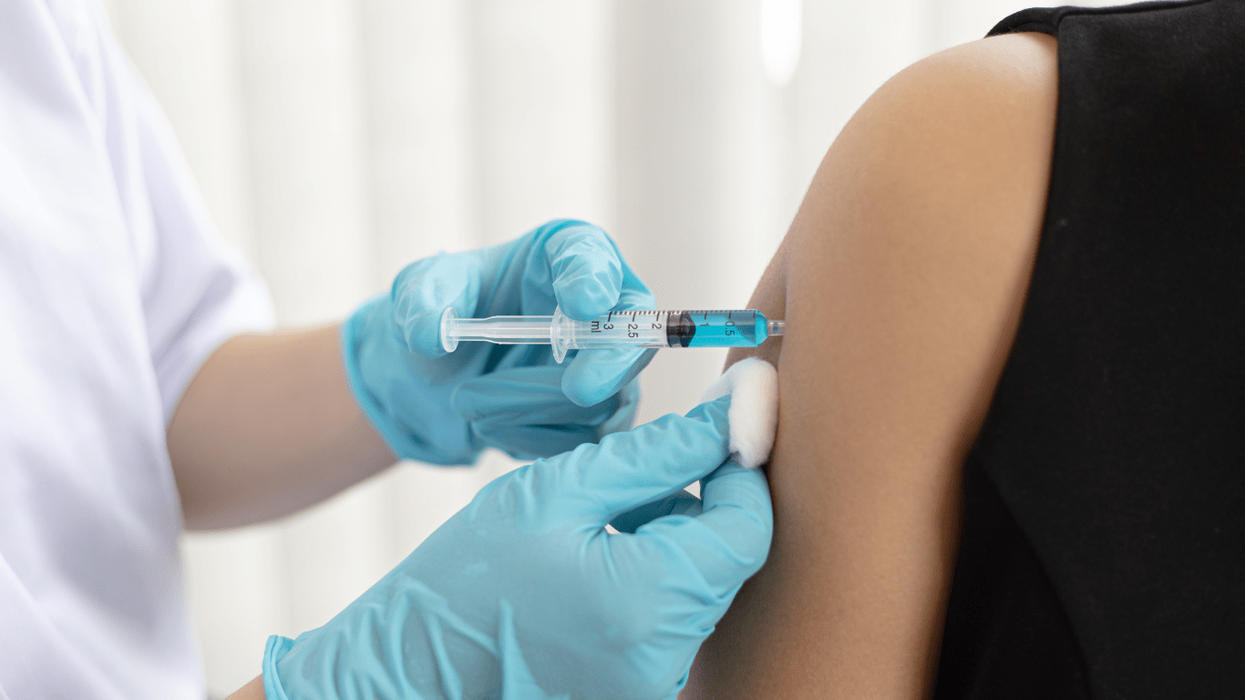 Someone getting a vaccine done