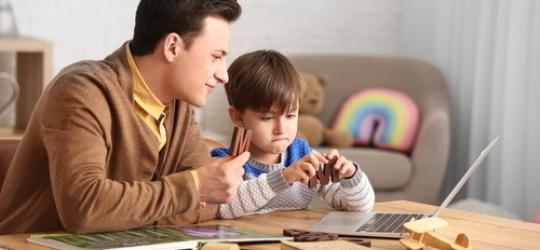 Speech therapist working with little boy