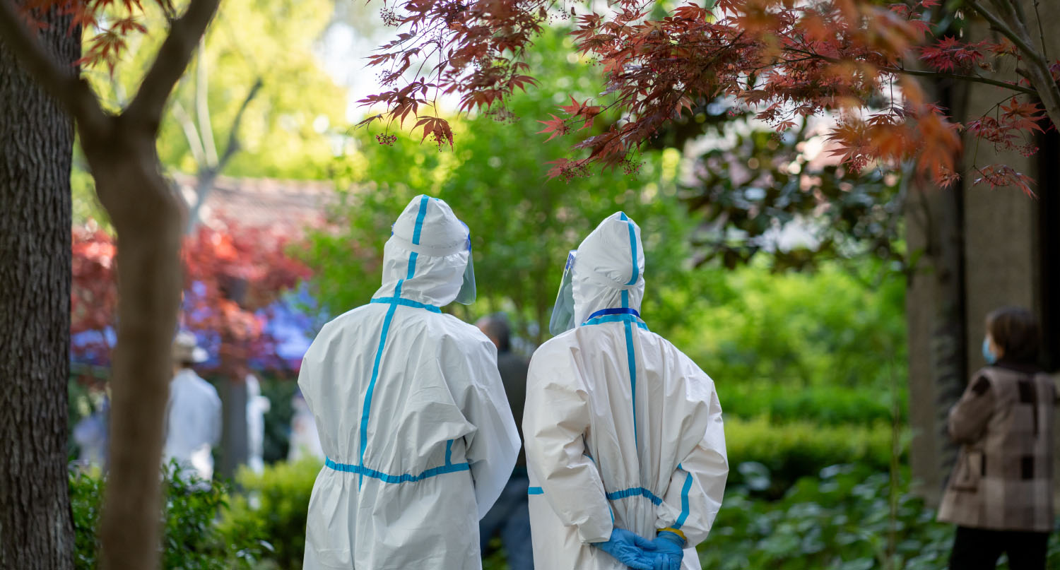 Healthcare workers in China in hazmat suits