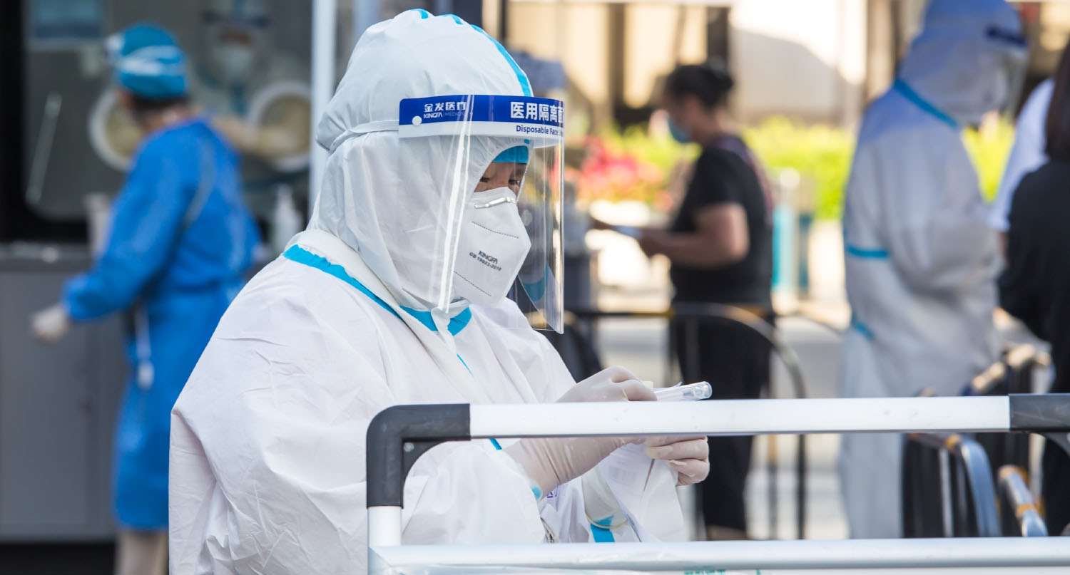 Healthcare worker preparing Covid test kits in China
