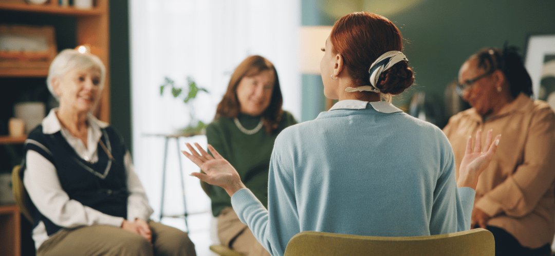 Therapist performing CBT therapy for ageing adult group