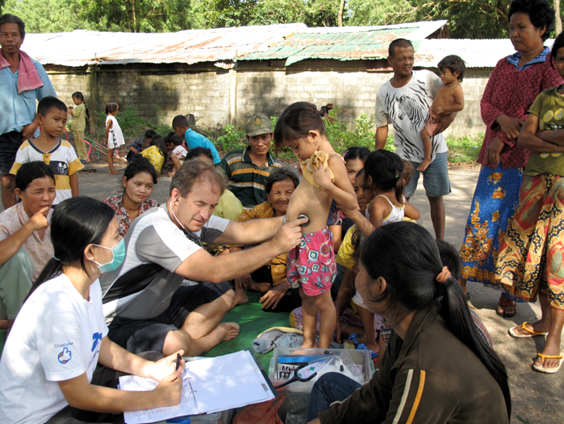 Dr Tim Trodd assessing little girl patient