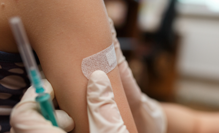 person getting polio vaccine in arm