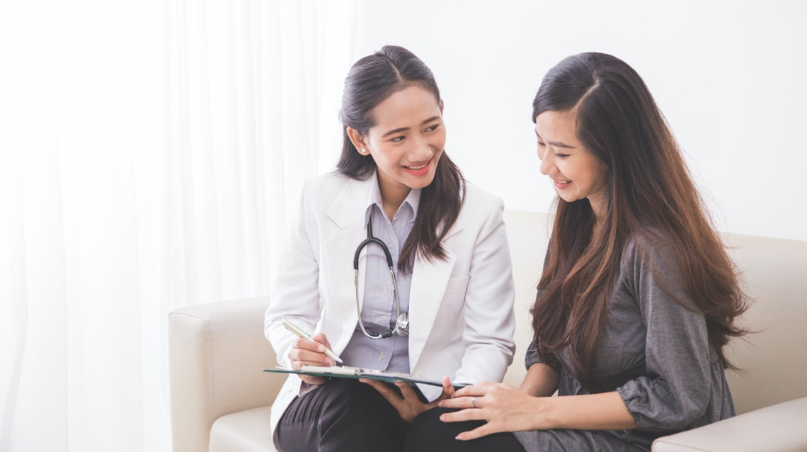 doctor talking to young patient about surgery