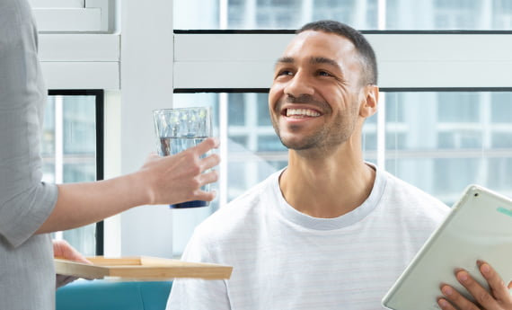 patient in clinic getting water
