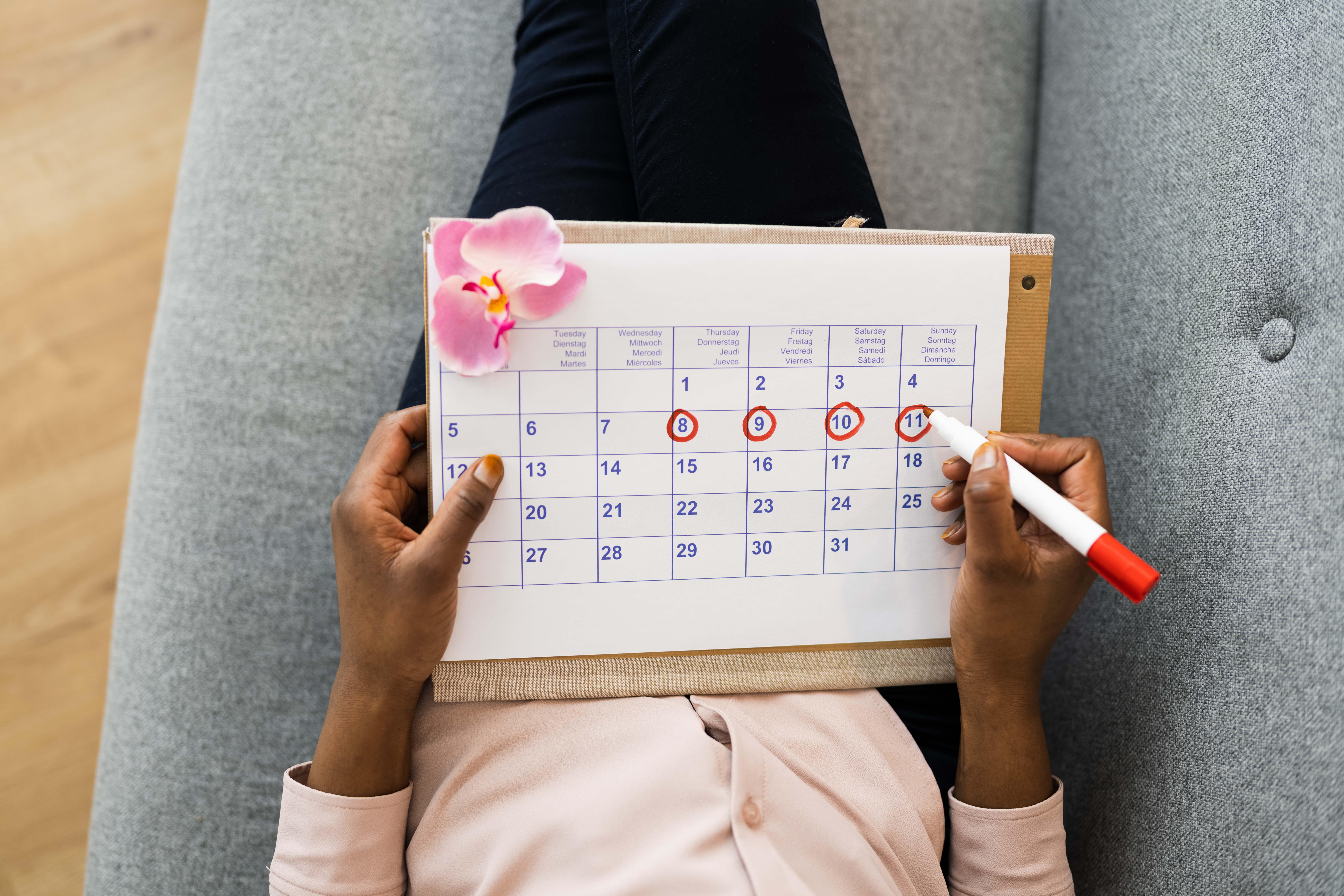 African Woman Using Menstrual Cycle Or Period Calendar