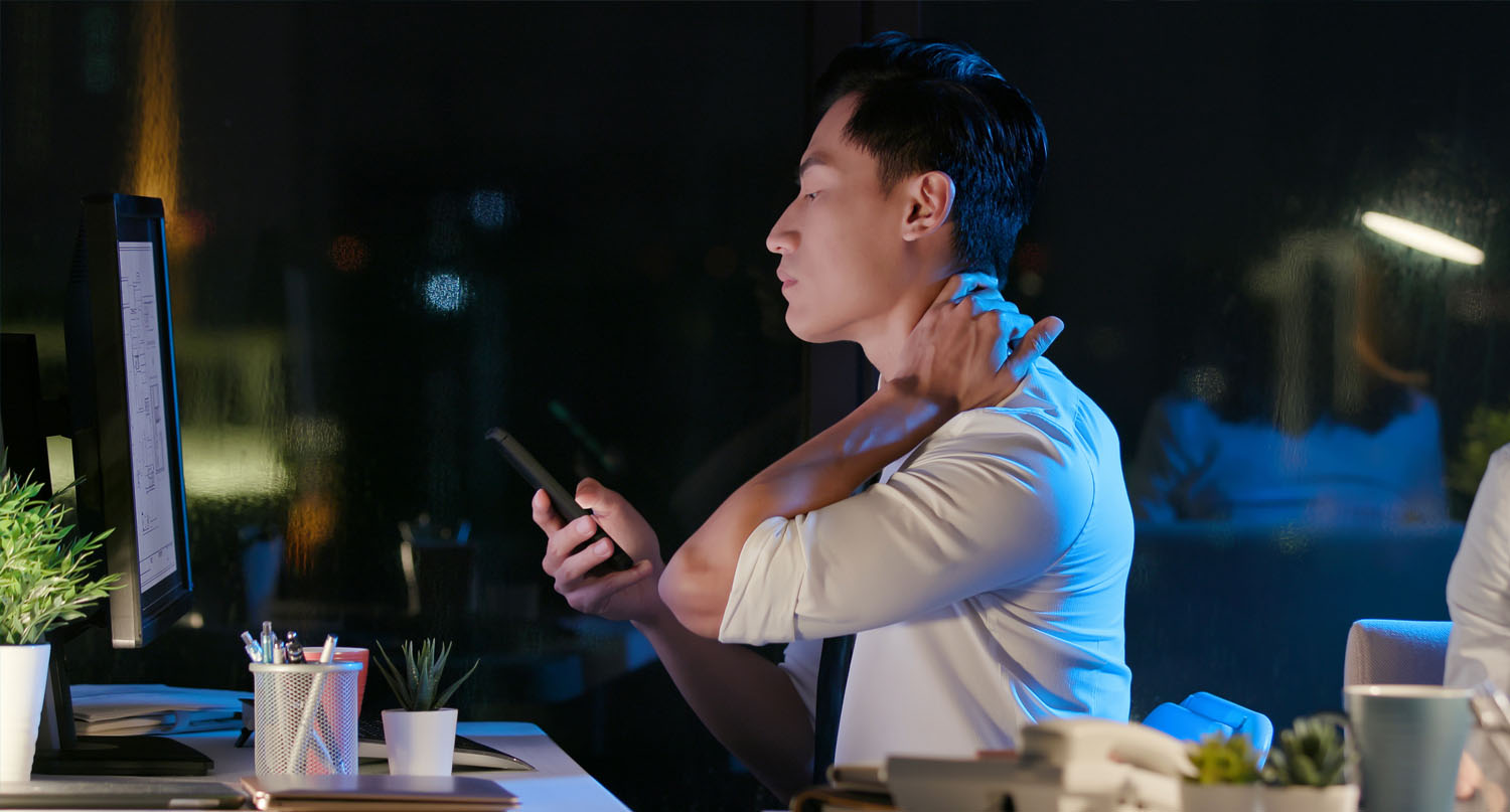Office worker feeling neck and shoulder pain